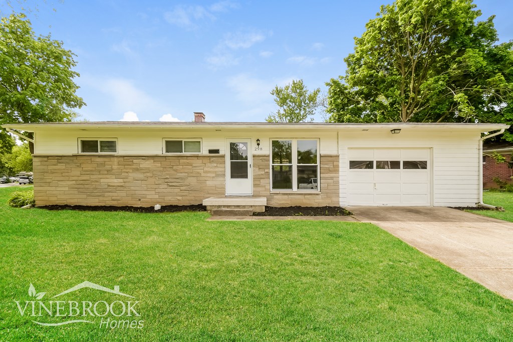 A two-story house with a garage is for sale.