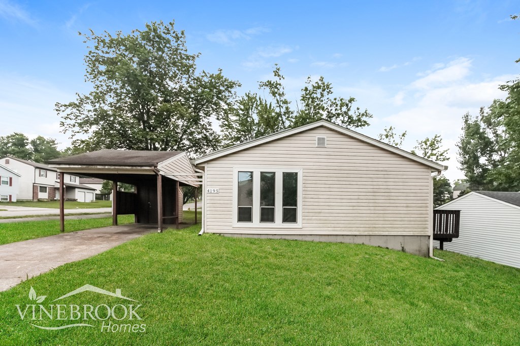 A Vinebrook Homes house with a covered patio and a garage.