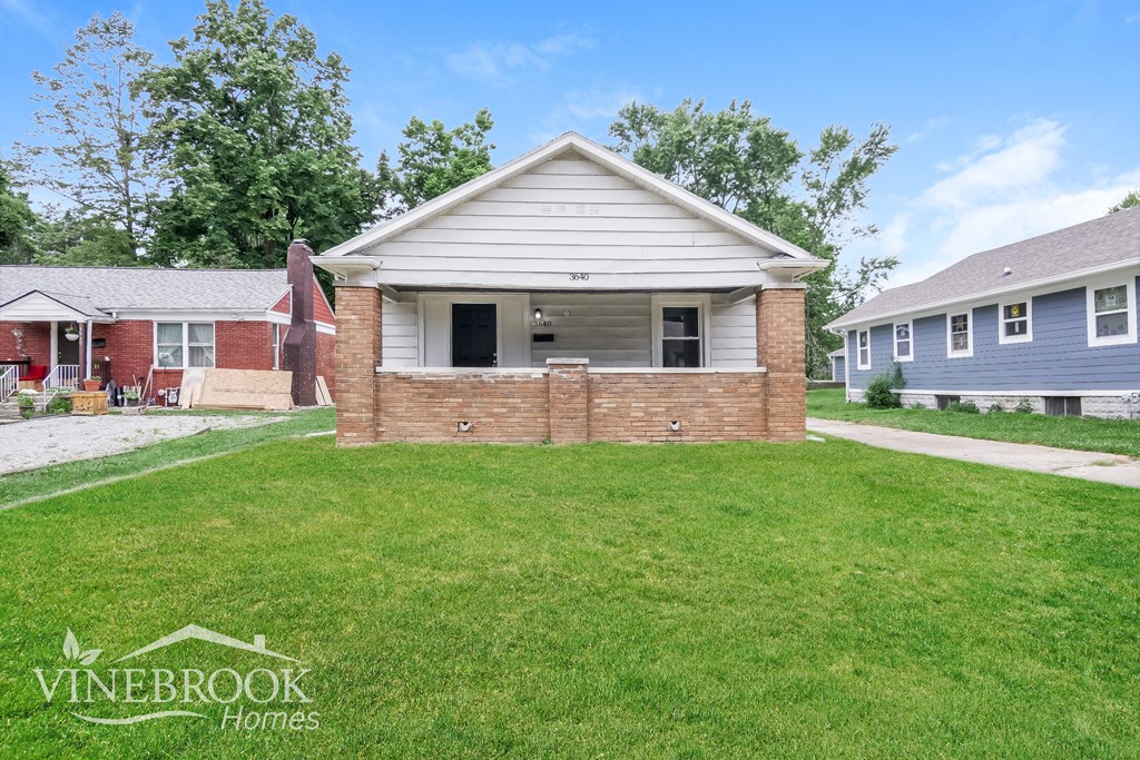 A house with a lawn in front of it is for sale.