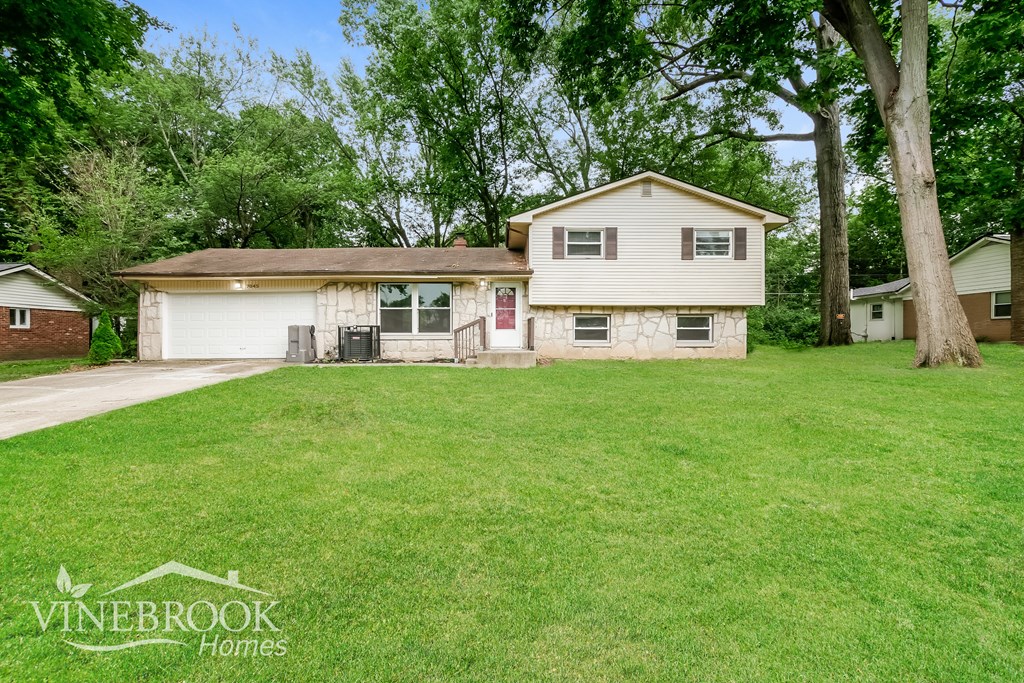 A house with a lawn in front of it is for sale.