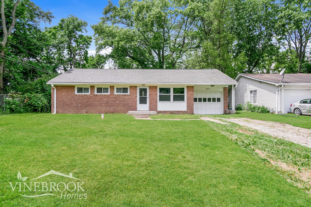 A house with a garage is for sale in Vinebrook Homes.