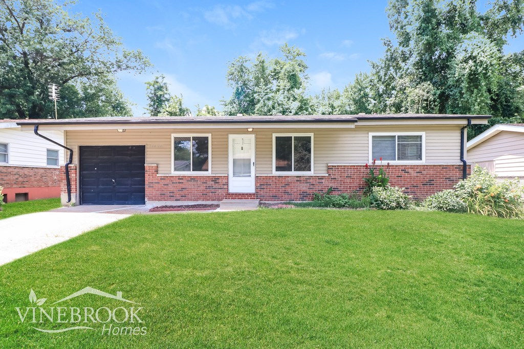 A Vinebrook Homes house with a green lawn in front.