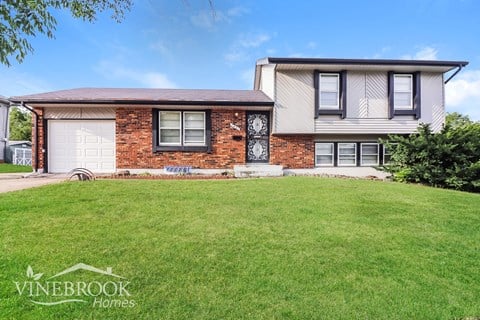 a house with a lawn in front of it