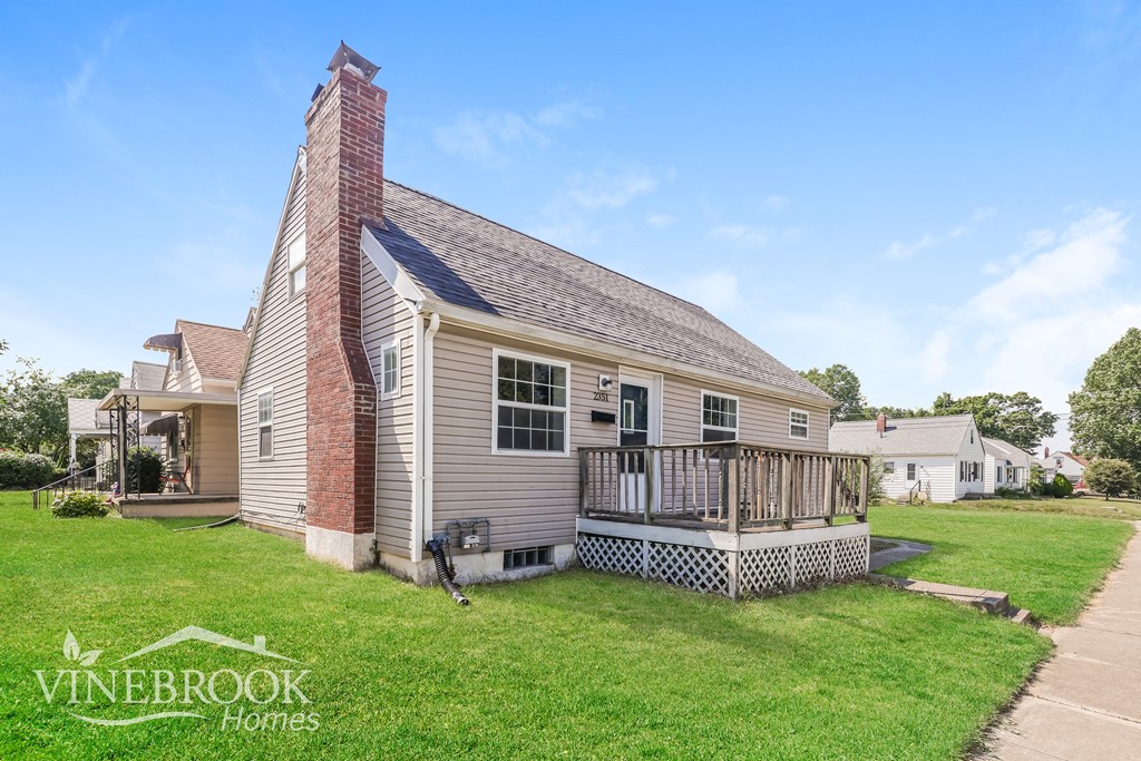 a small house with a porch and a deck