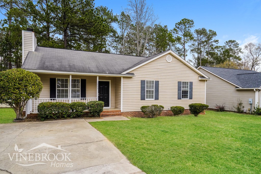 A house with a Vinebrook Homes sign in front.