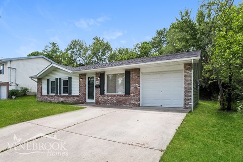 A house with a garage is for sale in Vinebrook Homes.