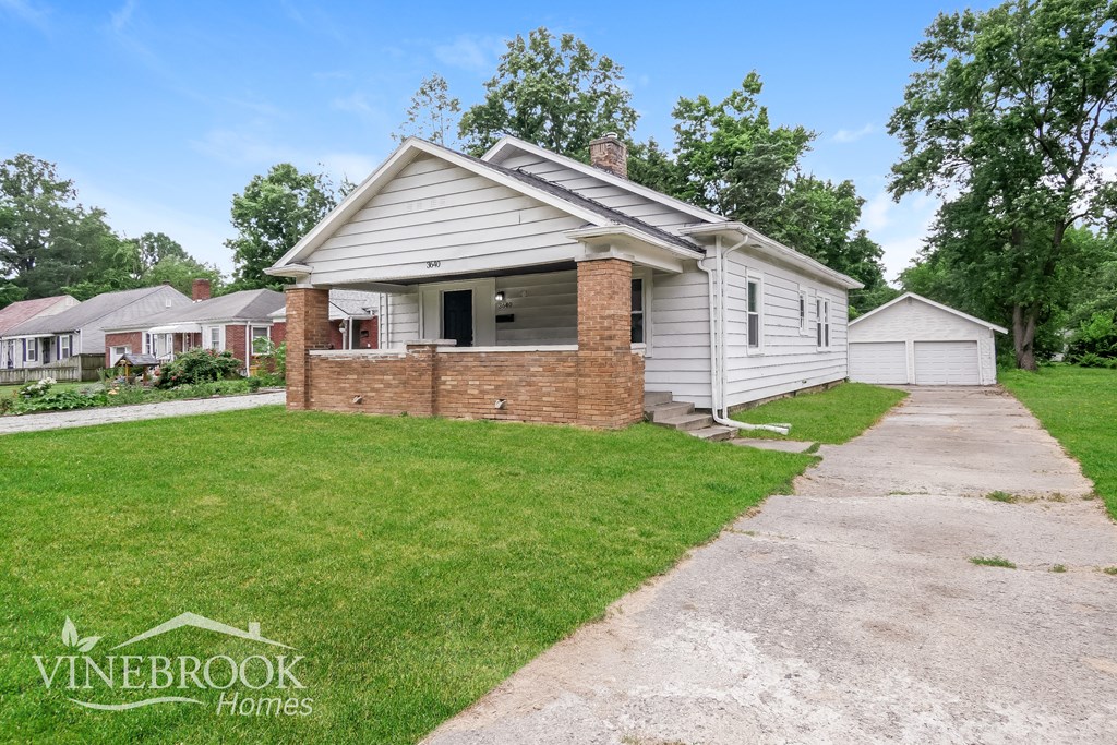 A house with a driveway in front of it.