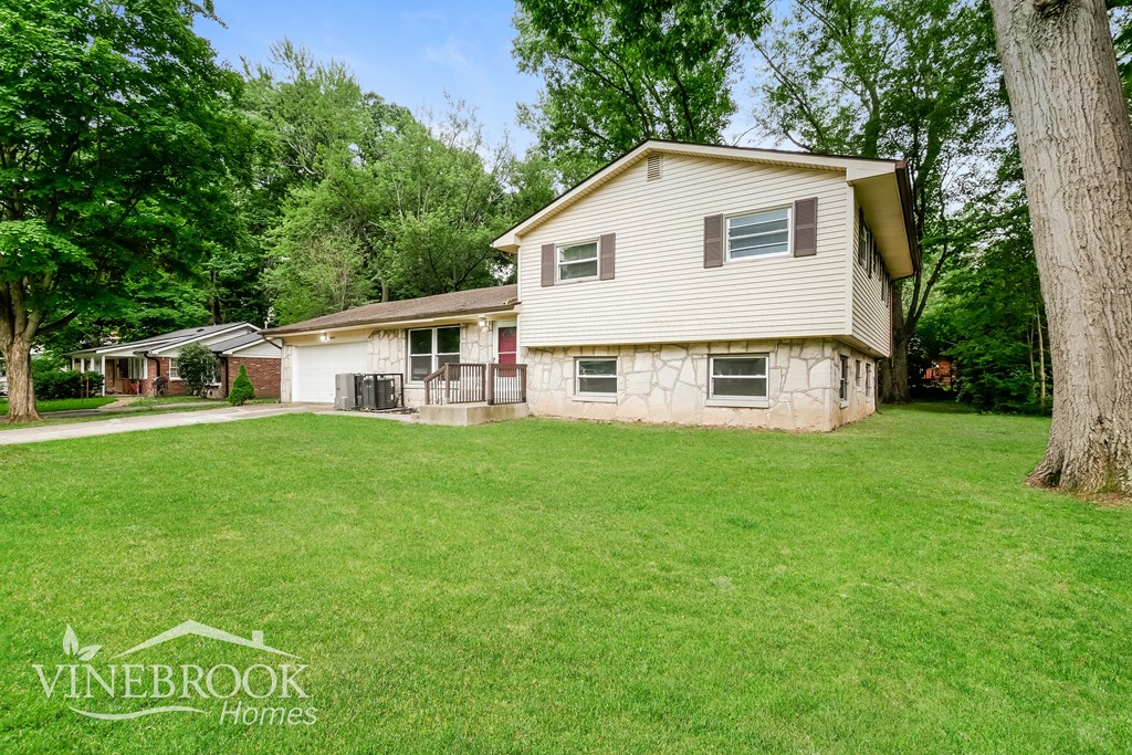A house with a lawn in front of it is for sale.