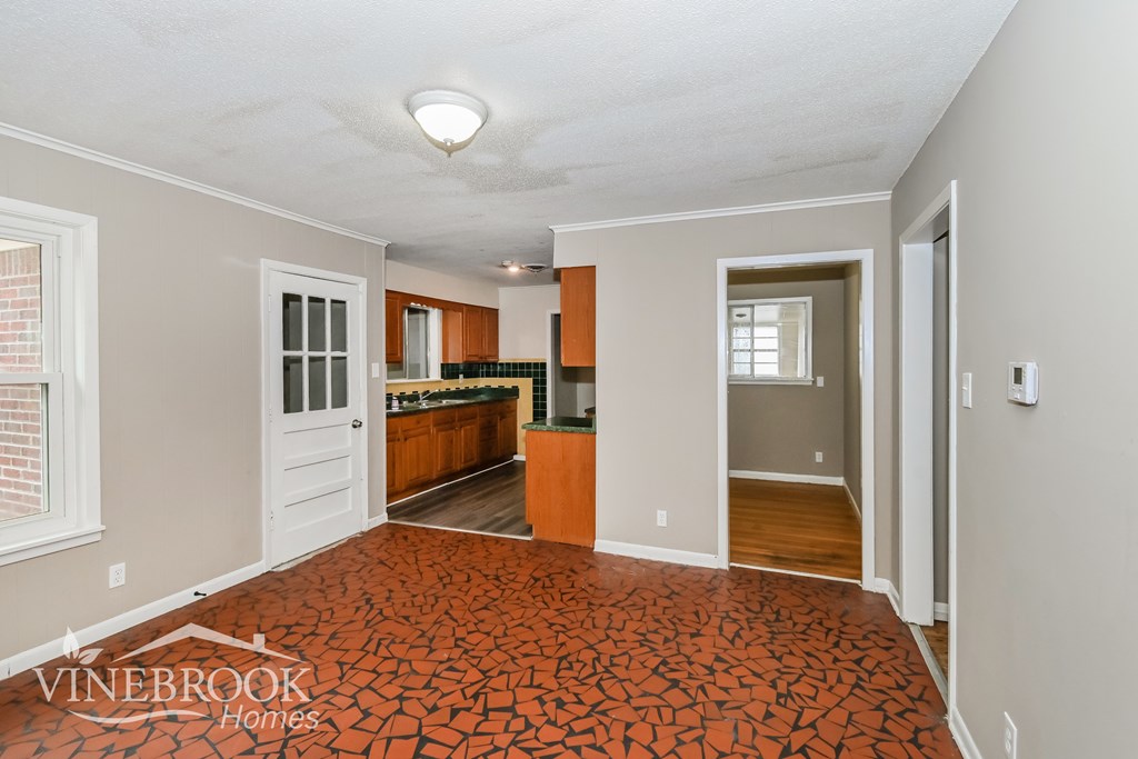 A room with a red floor and a white ceiling.