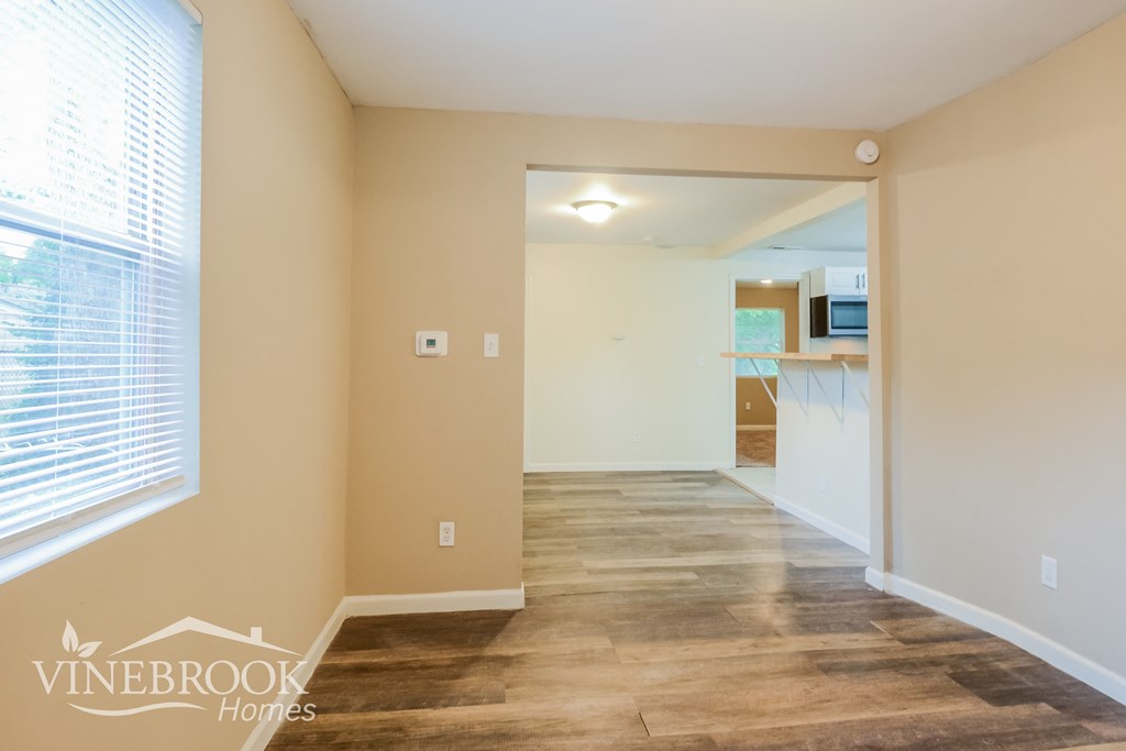 the living room and dining room are open to the kitchen