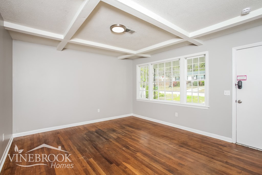 A room with a window and a door is shown.