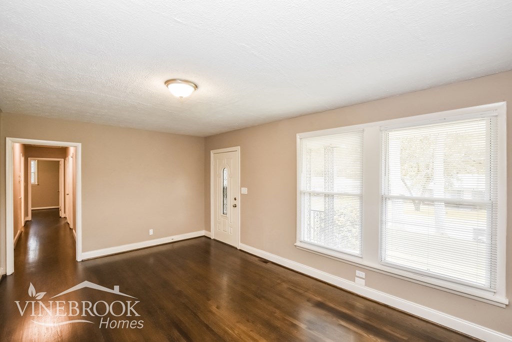 A room with a window and a door is shown.
