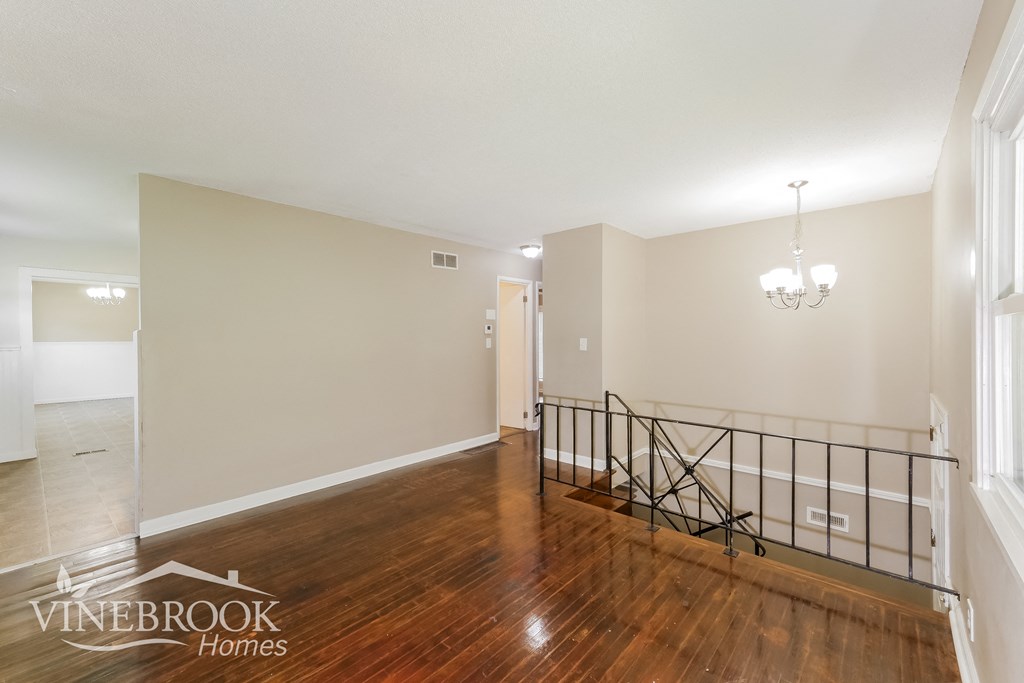 a view of the living room from the top of the stairs
