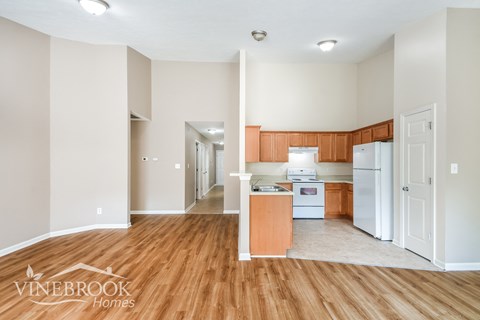 a view of the kitchen and living room from the dining room