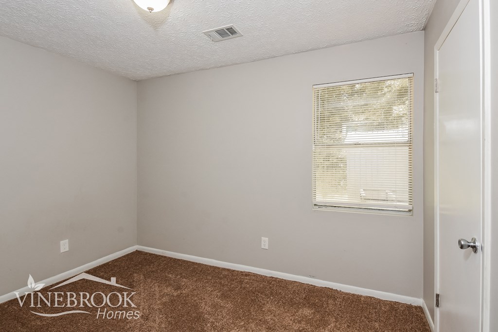 the living room of an apartment at the vineyard homes