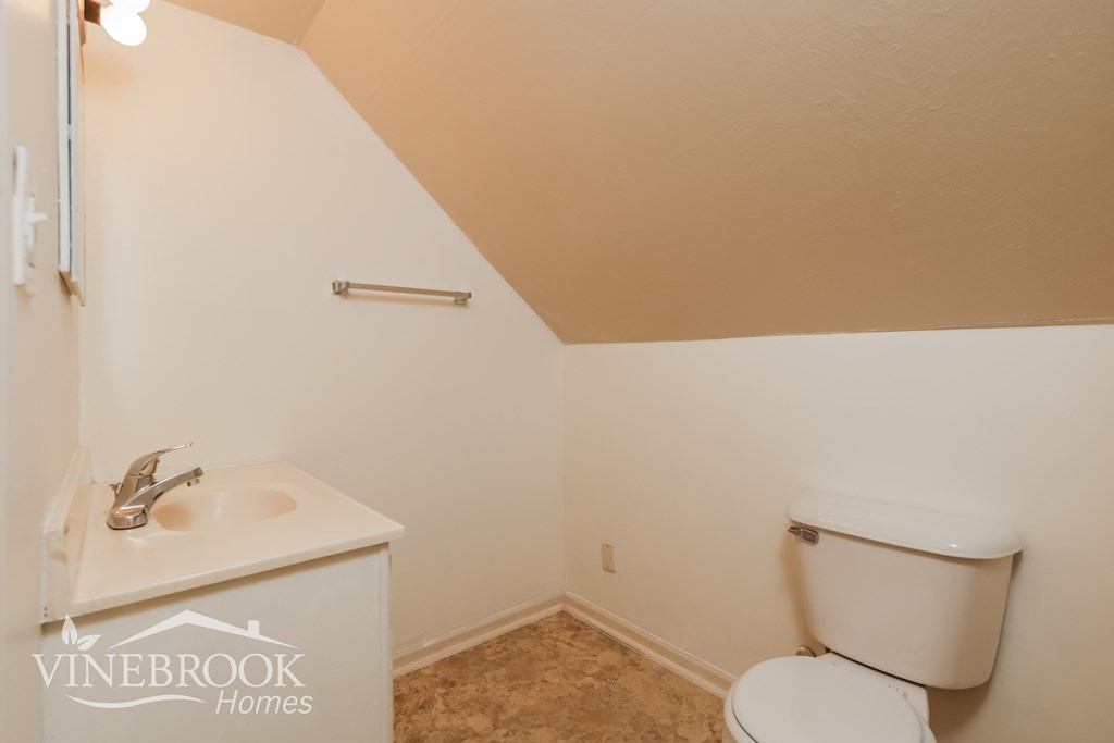 the upstairs bathroom has a toilet and a sink