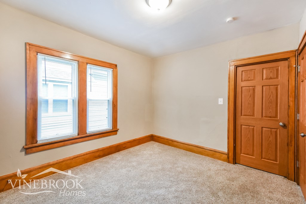 the second bedroom is empty and ready to be used as a play room
