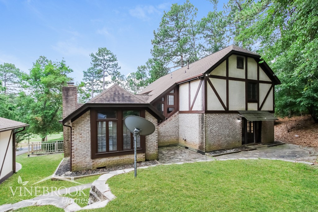 a house with a satellite dish in front of it