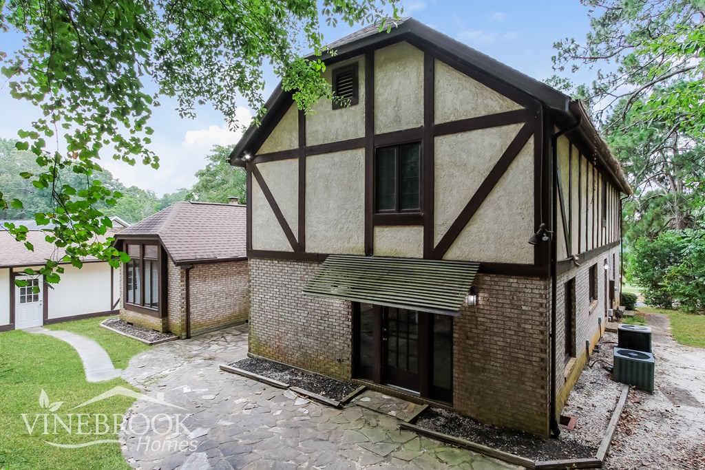 the front of a house with a garage and a driveway