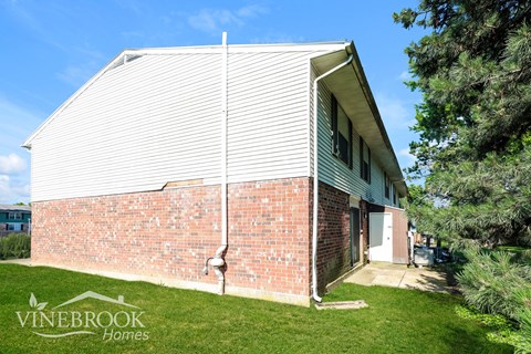 A house with a Vinebrook Homes sign in the foreground.