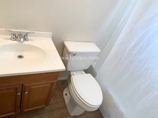 a bathroom with a toilet and a sink