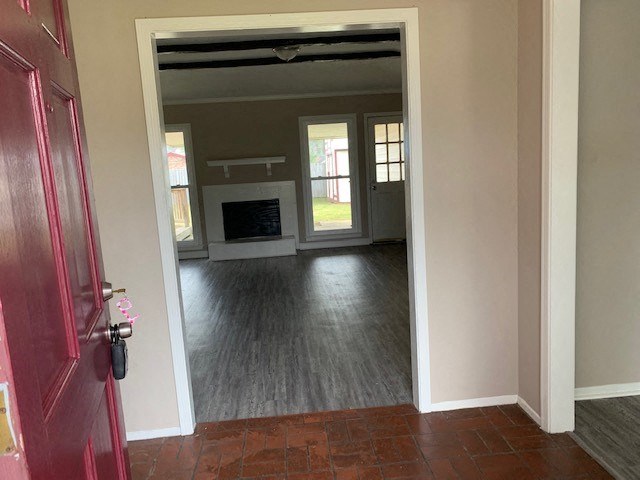 a empty living room with a red door