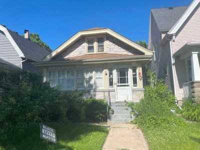 a house with a street sign in front of it