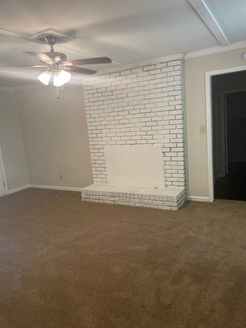 a living room with a brick fireplace and a ceiling fan