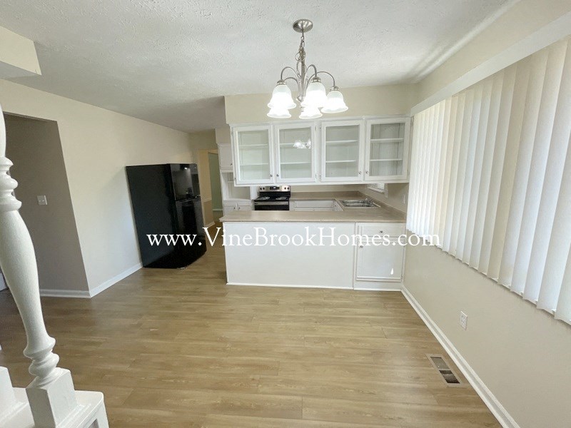 a view of the living room and kitchen from the stairs