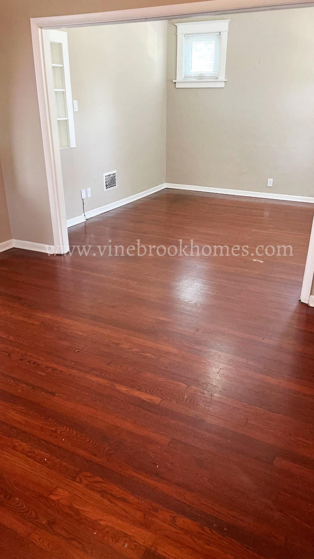 a hard wood floor in a room with white walls