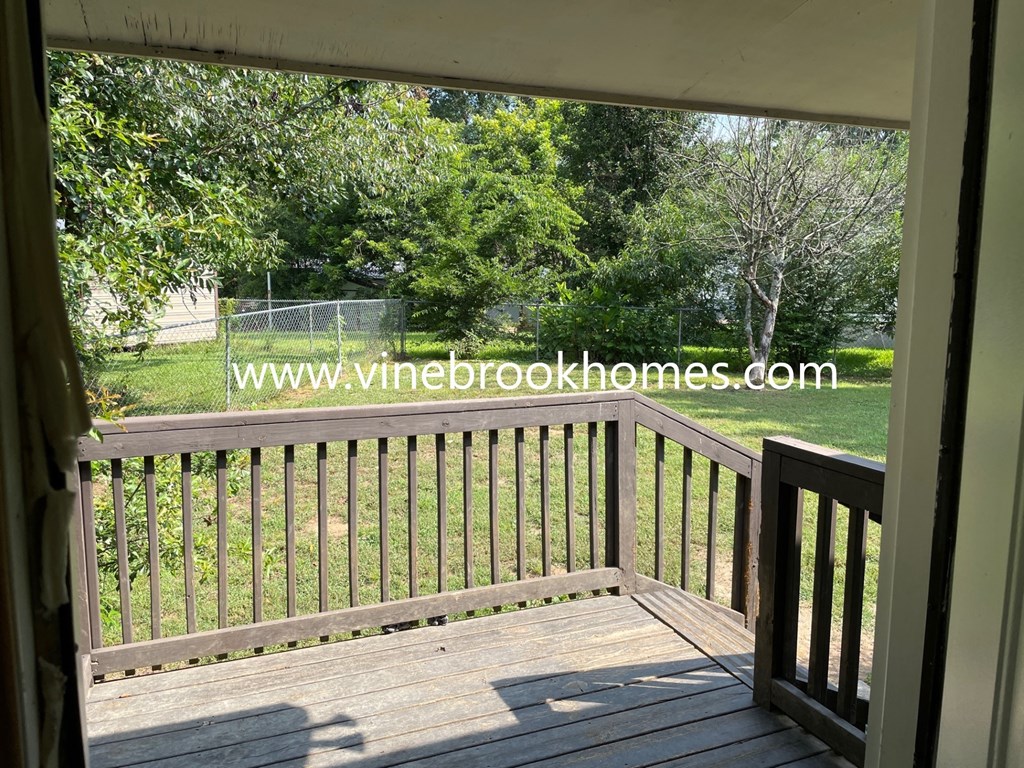 a view of the backyard from the porch of a house