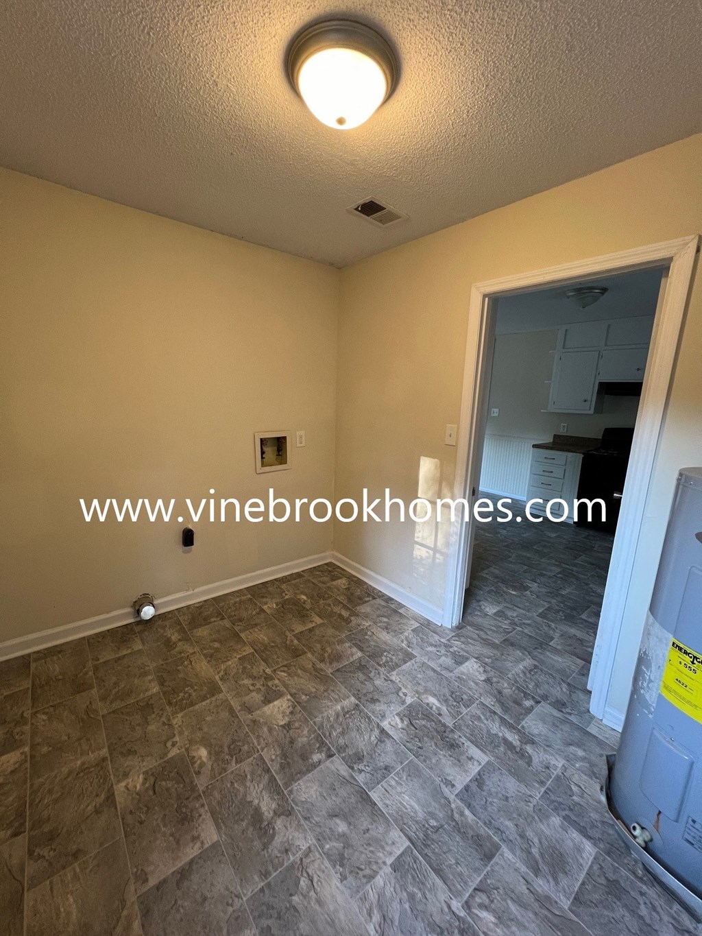 a look at the living room and entrance to the kitchen in a home for sale