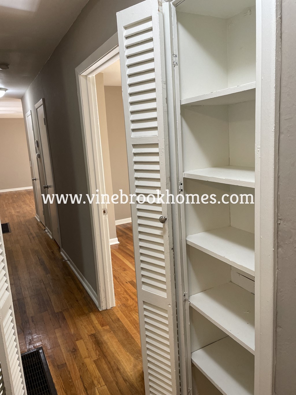 the walk in closet in the master bedroom has a mirrored closet door