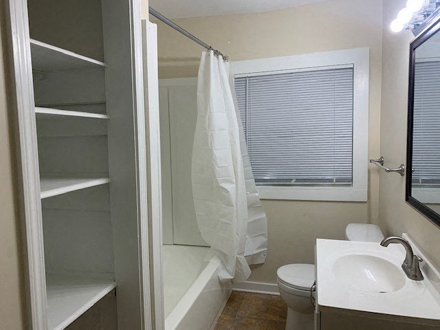 a bathroom with a sink toilet and a shower