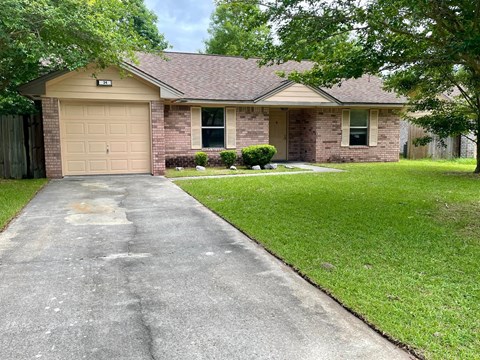 a house with a driveway and a garage door