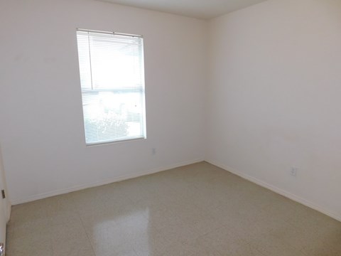 an empty room with a window in it