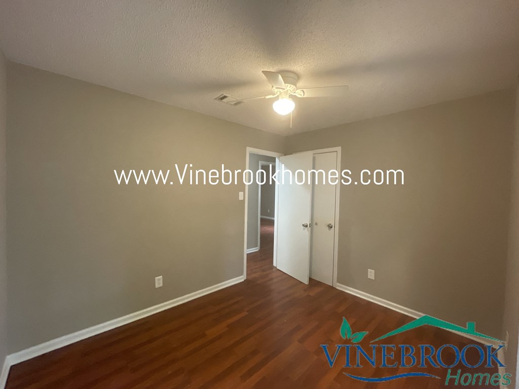 the living room and dining room of a hypothetical renovated house with hardwood flooring