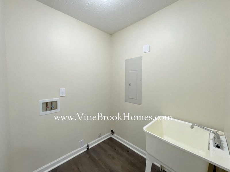a bathroom with a tub and a sink and a mirror