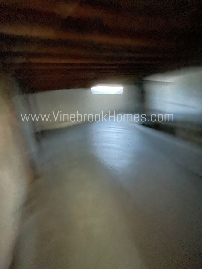 a view of the inside of a wine cellar with a window