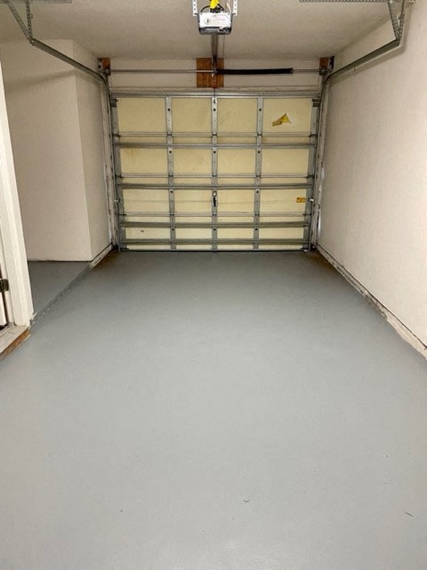 a room with a white floor and a bunk bed