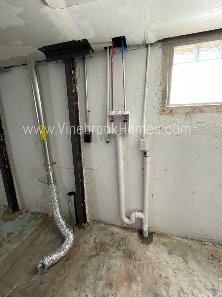 the pipes in the corner of a room that is being remodeled