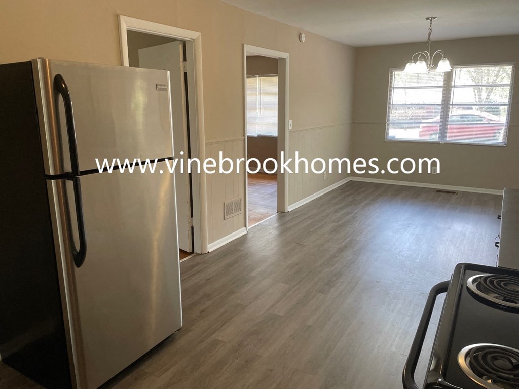 a kitchen and living room of a bedroom apartment