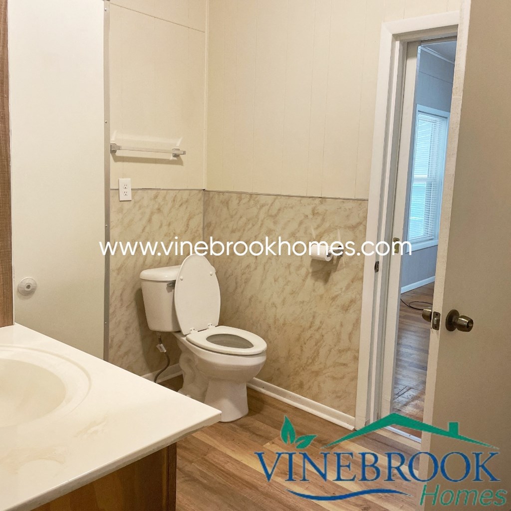 a small bathroom with a toilet and a shower