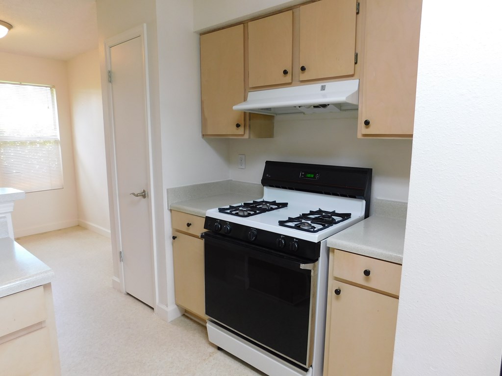 A small kitchen with a stove and oven.