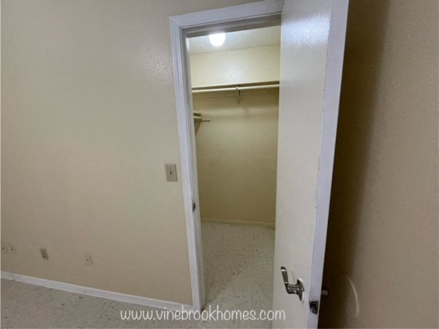 an open door leading into an empty closet in a home