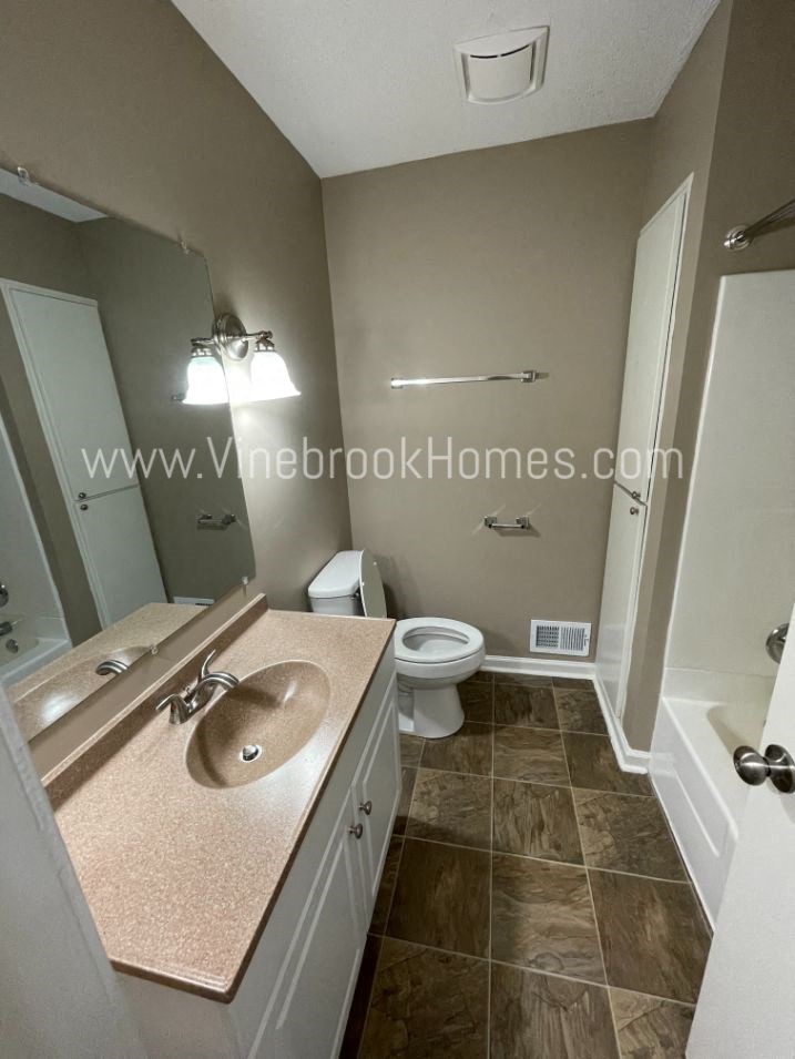 a bathroom with a sink and a toilet