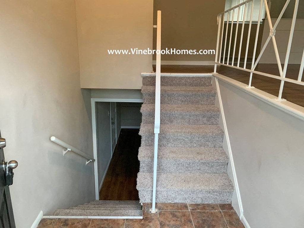 a view of the stairs from the top of the landing