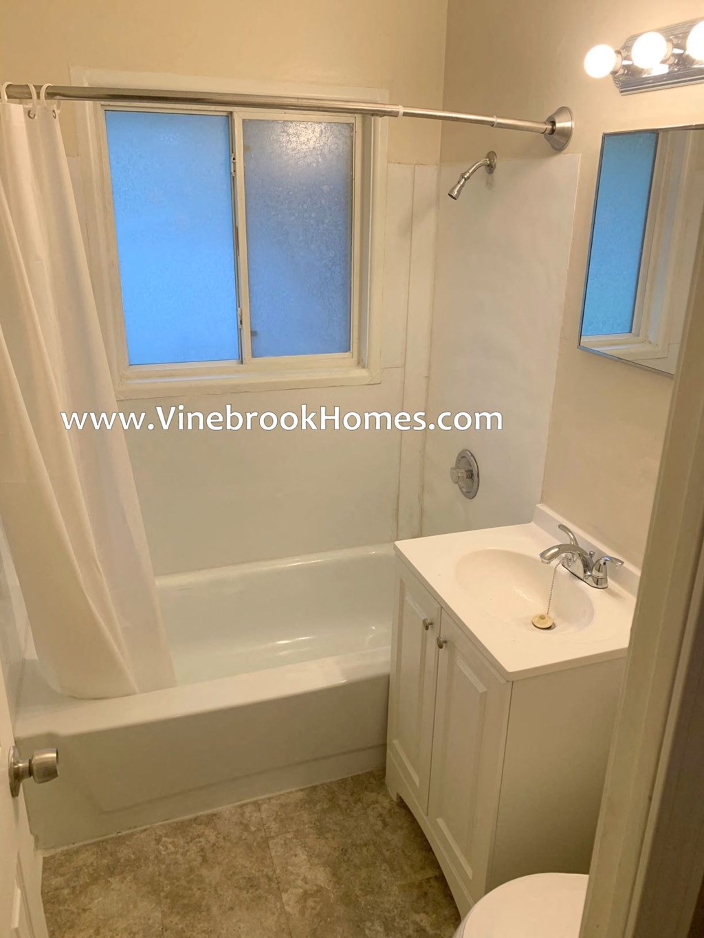 a small white bathroom with a sink and a toilet