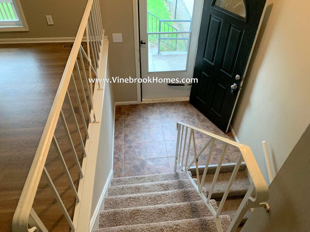 the stairway up to the front door of a house