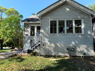 a gray house with a white and black checkered side